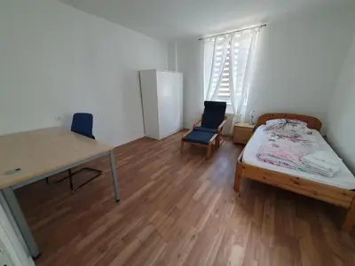 Ein Bett oder Betten in einem Zimmer der Unterkunft Zentrales, charmantes Zimmer an der Universitätsklinik Mainz