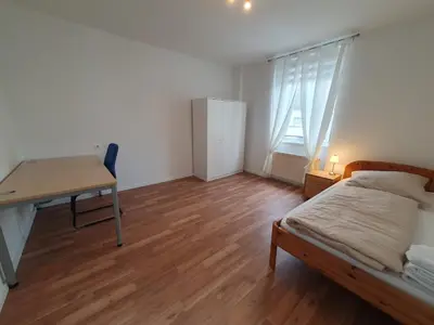 Ein Bett oder Betten in einem Zimmer der Unterkunft Zentrales, charmantes Zimmer an der Universitätsklinik Mainz