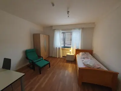 Ein Bett oder Betten in einem Zimmer der Unterkunft Zentrales, charmantes Zimmer an der Universitätsklinik Mainz
