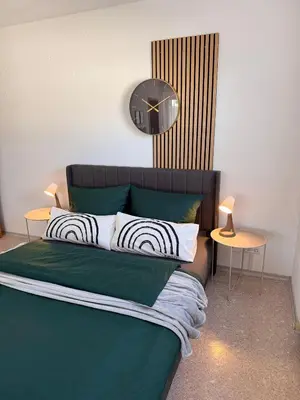 Ein Bett oder Betten in einem Zimmer der Unterkunft La Inside Apartment