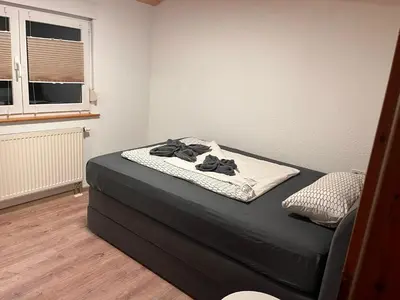 Ein Bett oder Betten in einem Zimmer der Unterkunft Dachstub