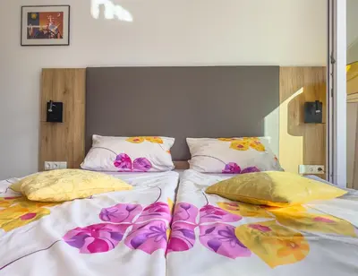 Ein Bett oder Betten in einem Zimmer der Unterkunft Hotel Restaurant Traube Kallstadt