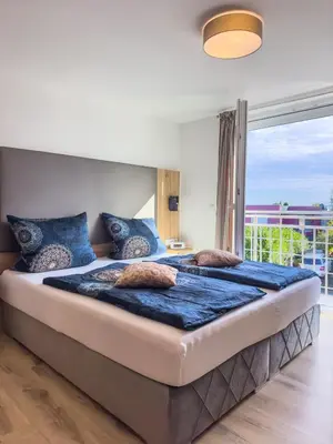 Ein Bett oder Betten in einem Zimmer der Unterkunft Hotel Restaurant Traube Kallstadt