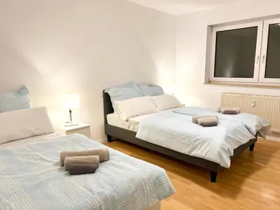 Ein Bett oder Betten in einem Zimmer der Unterkunft Modern und Gemütlich, Ferienwohnung mit Balkon und Netflix in Leimen WeHome Komfort