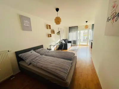 Ein Bett oder Betten in einem Zimmer der Unterkunft Sonnige, zentralgelegene Wohnung