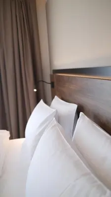 Ein Bett oder Betten in einem Zimmer der Unterkunft UNICO Boutique Hotel