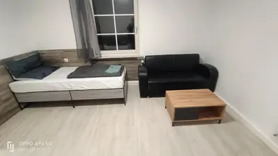 Ein Bett oder Betten in einem Zimmer der Unterkunft Opel2-Apartmenhaus