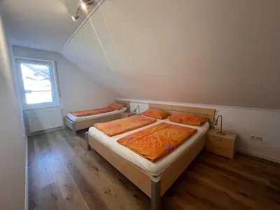 Ein Bett oder Betten in einem Zimmer der Unterkunft Apartmenthaus Gärtner