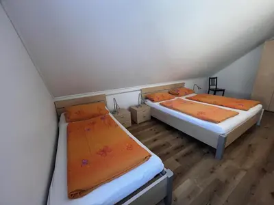 Ein Bett oder Betten in einem Zimmer der Unterkunft Apartmenthaus Gärtner