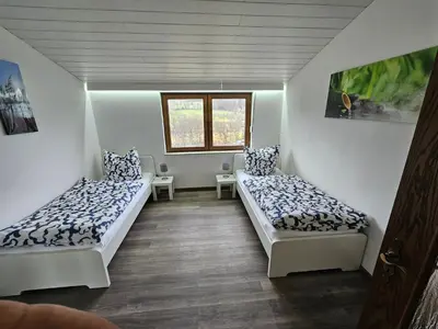 Ein Bett oder Betten in einem Zimmer der Unterkunft Ferienwohnung am Heuberg