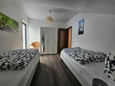 Ein Bett oder Betten in einem Zimmer der Unterkunft Ferienwohnung am Heuberg