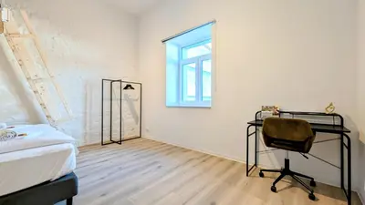 Ein Bett oder Betten in einem Zimmer der Unterkunft Velaris - Stilvolle Lofts & Penthouses - Premium Wohnen mit Parkplatz & Workstations