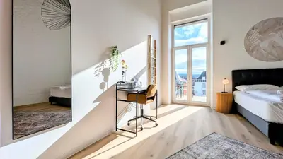 Ein Bett oder Betten in einem Zimmer der Unterkunft Velaris - Stilvolle Lofts & Penthouses - Premium Wohnen mit Parkplatz & Workstations