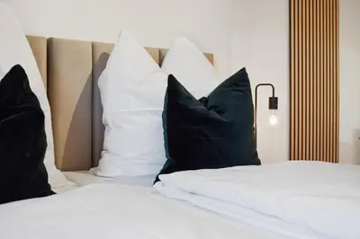 Ein Bett oder Betten in einem Zimmer der Unterkunft Moderne, ruhige Wohnung mit Parkplatz