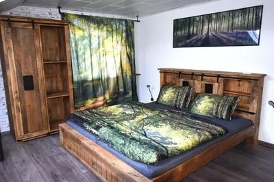 Ein Bett oder Betten in einem Zimmer der Unterkunft Ferienwohnung Odenwaldwellness