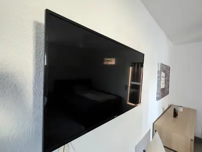 TV/Unterhaltungsangebot in der Unterkunft Waldstadt Charme Hideaway Küche-Balkon-Netflix