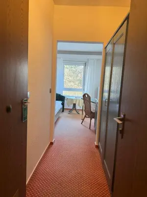 Ein Bett oder Betten in einem Zimmer der Unterkunft Hotel Das Waldhaus in Maikammer