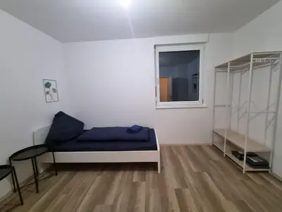 Ein Bett oder Betten in einem Zimmer der Unterkunft Monteurwohnung Pforzheim - L8 Street