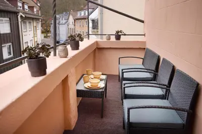 Ein Sitzbereich in der Unterkunft Design Apartment mit Kingsize-Betten & Balkon