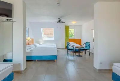Ein Bett oder Betten in einem Zimmer der Unterkunft Heilbronner Pension am schönen Theater