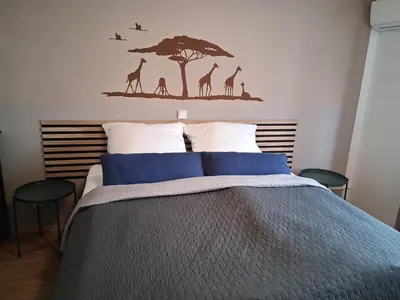 Ein Bett oder Betten in einem Zimmer der Unterkunft Fewo Gartenblick Altlußheim - Netflix- parken - Küche - Klimaanlage - Shuttle zum Hockenheimring