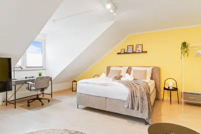 Ein Bett oder Betten in einem Zimmer der Unterkunft Kingsize Bett, Balkon, Arbeitsplatz, Netflix