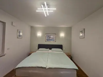 Ein Bett oder Betten in einem Zimmer der Unterkunft Apartment Camelia