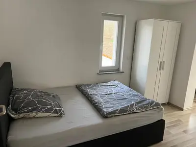 Ein Bett oder Betten in einem Zimmer der Unterkunft Haus Anna Bensheim