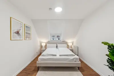 Ein Bett oder Betten in einem Zimmer der Unterkunft STARLIVING Premium Home I 4,5 Schlafzimmer für 8 Gäste