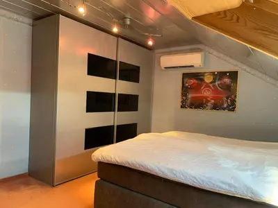 Ein Bett oder Betten in einem Zimmer der Unterkunft klimatisiere Dachwohnung in Weinsberg-Gellmersbach