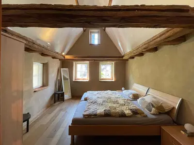 Ein Bett oder Betten in einem Zimmer der Unterkunft Schlafgut-Freytag Ferienhaus Pfälzer Bu
