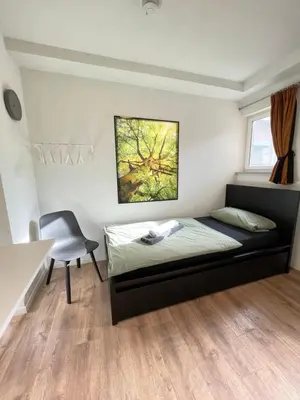Ein Bett oder Betten in einem Zimmer der Unterkunft Pension Keck im Weinsberger Tal