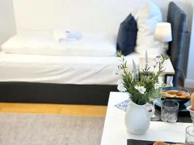 Ein Bett oder Betten in einem Zimmer der Unterkunft BELLA - Business&Family Ap 5, 100m zum Konzerteingang Schloß, Parkplatz, SmartTV, Netflix, Waschmaschine,24h Checkin, 30qm