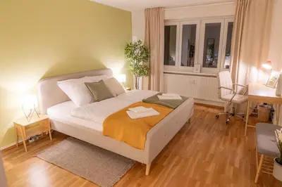 Ein Bett oder Betten in einem Zimmer der Unterkunft K15 Cozy, Unique & Spacious 3-Room Apartment with Balcony or Single Room by LIPA