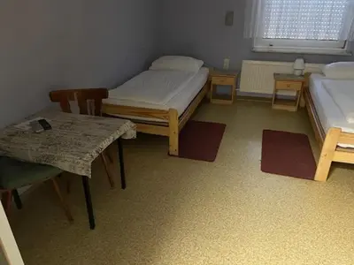 Ein Bett oder Betten in einem Zimmer der Unterkunft Gaststätte Wiesengrund
