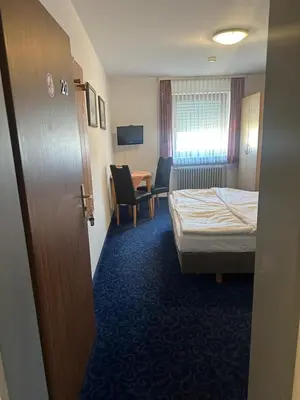 Ein Bett oder Betten in einem Zimmer der Unterkunft Hotel Alt Nürnberg