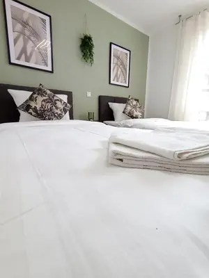 Ein Bett oder Betten in einem Zimmer der Unterkunft WAT Wohnung KL