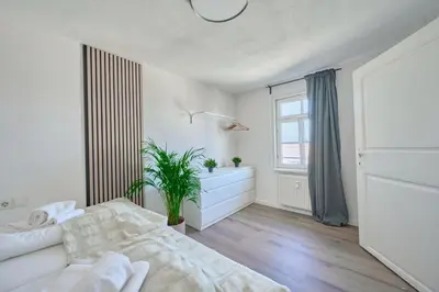 Ein Bett oder Betten in einem Zimmer der Unterkunft BackHome - MAISIONETTE - Parkplatz - Fantastische Schlosslage - SmartTV - Waschmaschine - Netflix - 70qm - 24h Checkin- Apartment 5