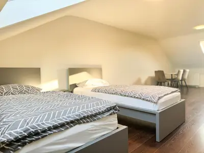Ein Bett oder Betten in einem Zimmer der Unterkunft Moderne DG Wohnung in Linkenheim