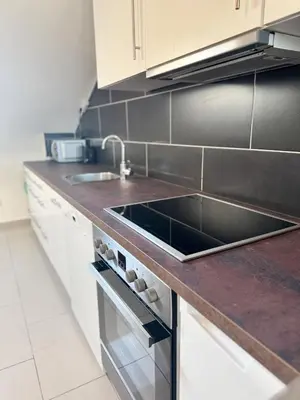Küche/Küchenzeile in der Unterkunft Moderne DG Wohnung in Linkenheim
