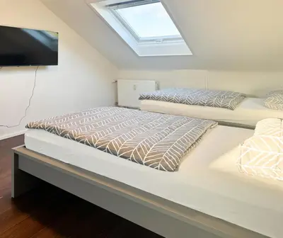 Ein Bett oder Betten in einem Zimmer der Unterkunft Moderne DG Wohnung in Linkenheim