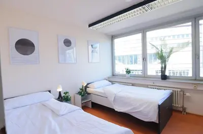Ein Bett oder Betten in einem Zimmer der Unterkunft MZK Maier Inexpensive and central