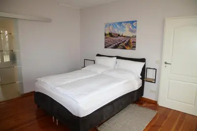 Ein Bett oder Betten in einem Zimmer der Unterkunft Ferienwohnung am Goldberg