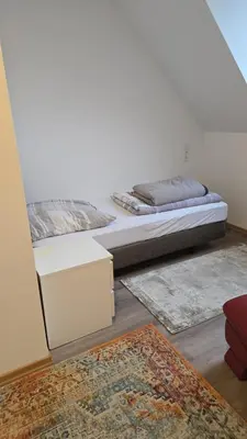 Ein Bett oder Betten in einem Zimmer der Unterkunft Gästehaus am Marktplatz
