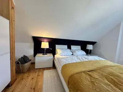 Ein Bett oder Betten in einem Zimmer der Unterkunft Ferienhaus Wein & Wald mit Gartensauna, eigenem Garten, Landau Pfalz