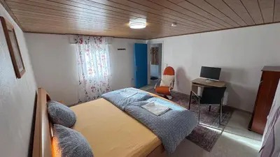 Ein Bett oder Betten in einem Zimmer der Unterkunft Ferienhaus in Lambsheim- 