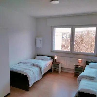 Ein Bett oder Betten in einem Zimmer der Unterkunft MZK Maier Schöne Aussicht, Preiswert