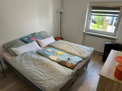 Ein Bett oder Betten in einem Zimmer der Unterkunft Ferienwohnung Am Kirschbaum Mömlingen