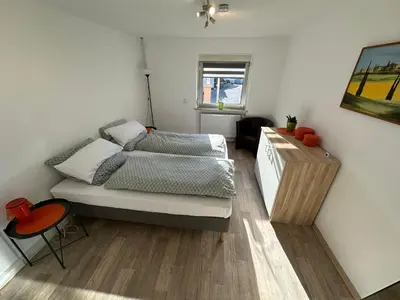Ein Bett oder Betten in einem Zimmer der Unterkunft Ferienwohnung Am Kirschbaum Mömlingen