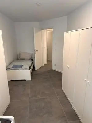 Ein Bett oder Betten in einem Zimmer der Unterkunft Moderne Wohnung für 4 Personen mit extra Schlafzimmer, Wohnzimmer & Balkon